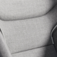 A close up photo of a Volvo seat covered in gray fabric.